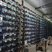 An expansive view of a Norwegian mining farm powered by hydropower, showcasing rows of efficient mining rigs